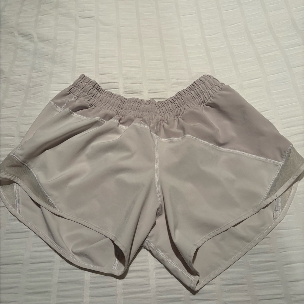Rare find. Lululemon Hotty Hot shorts- white and gray
